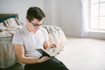man reading book